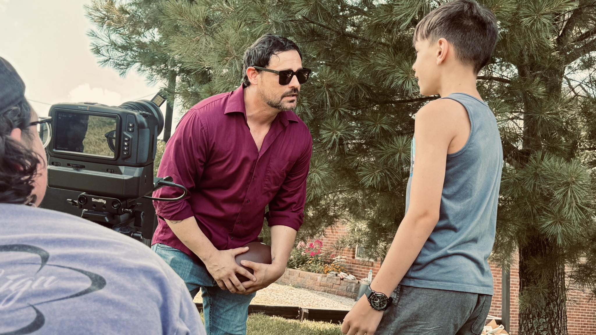 Director on set with cast during principal photography